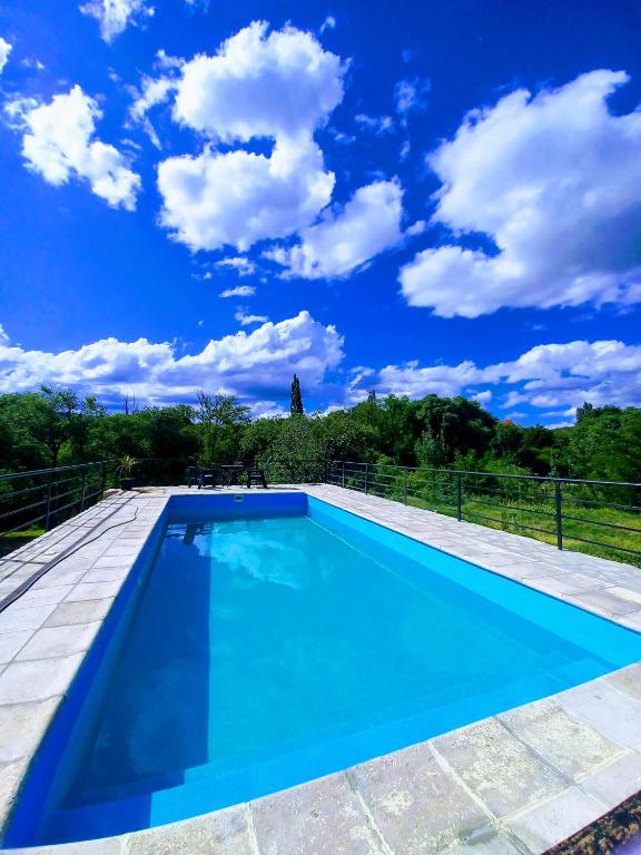 a swimming pool on the roof of a house at Complejo vacacional Piedra&Sol in Trapiche