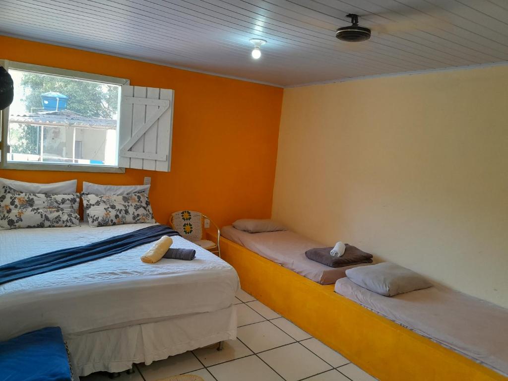 Katil atau katil-katil dalam bilik di Ubatuba SP Sertão Ubatumirim Casa para até 10 pessoas