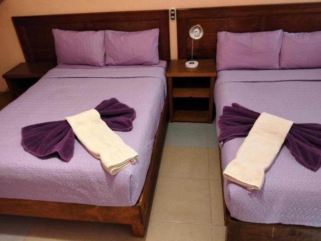 Postel nebo postele na pokoji v ubytování Hotel Tres Flores