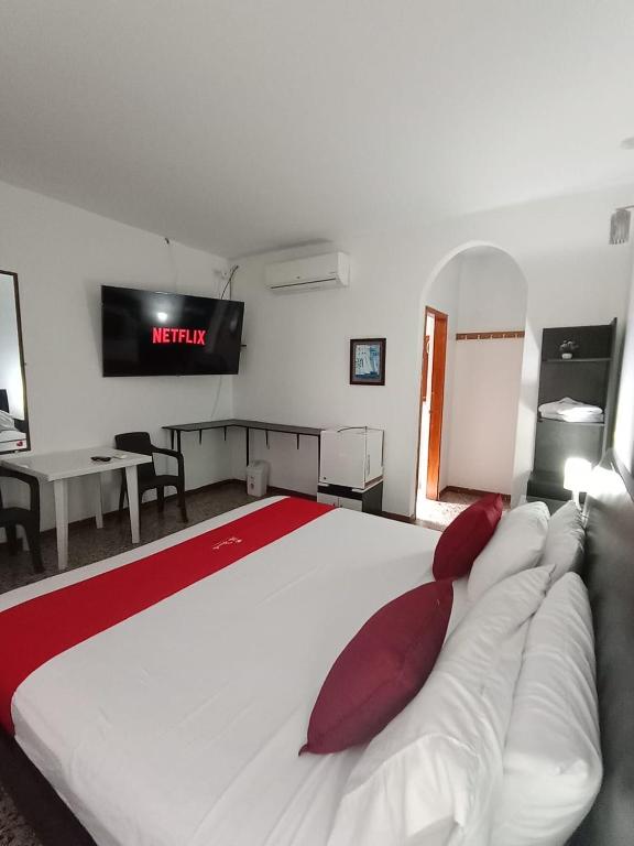 Postel nebo postele na pokoji v ubytování Hotel Villa Ricaurte
