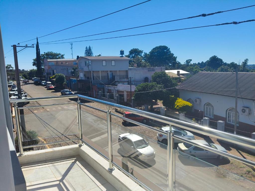 a balcony with a car parked on a street at Departamentos Alta Vista 1 in Dos de Mayo