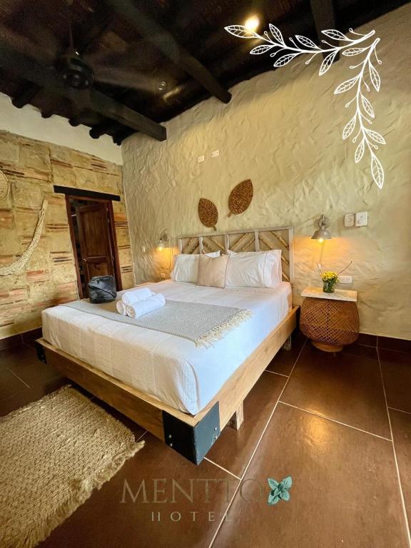 Postel nebo postele na pokoji v ubytování Mentto Hotel