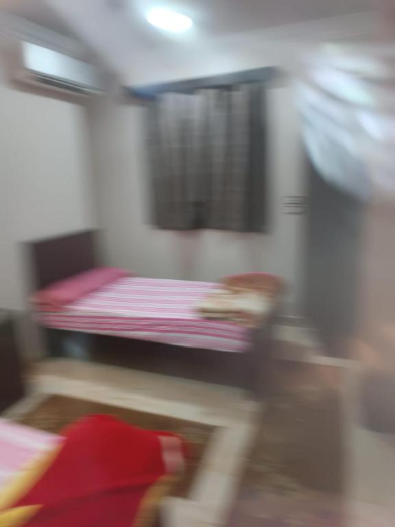 Postel nebo postele na pokoji v ubytování فندق الإيمان El Eman Hotel