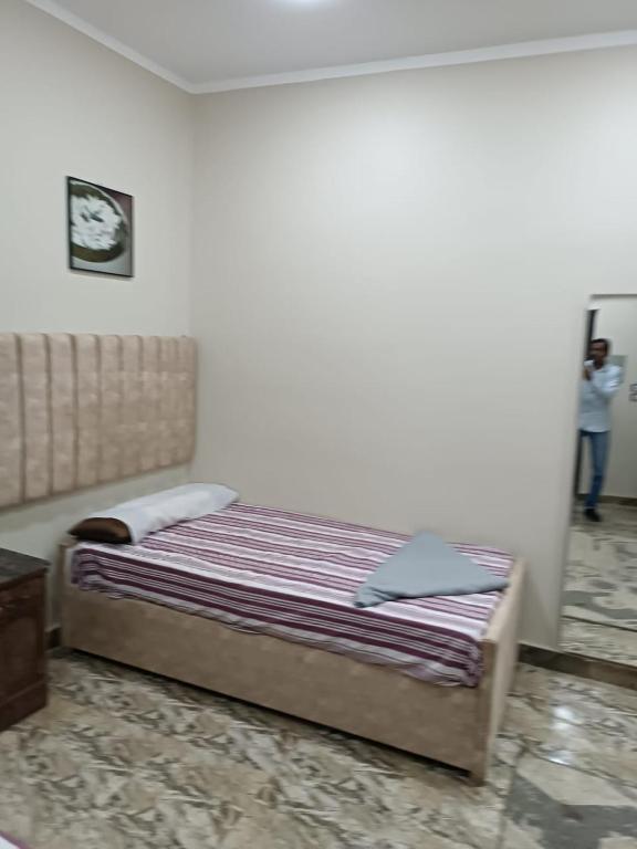 Postel nebo postele na pokoji v ubytování فندق الإيمان El Eman Hotel