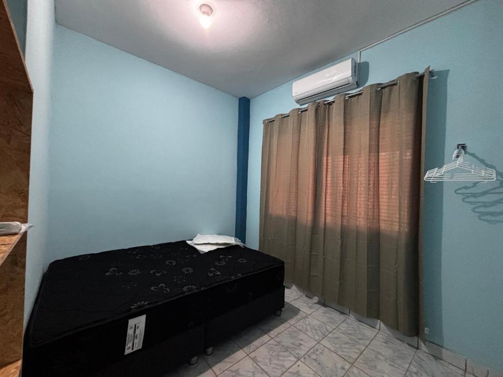 Postel nebo postele na pokoji v ubytování Cuarto Queen