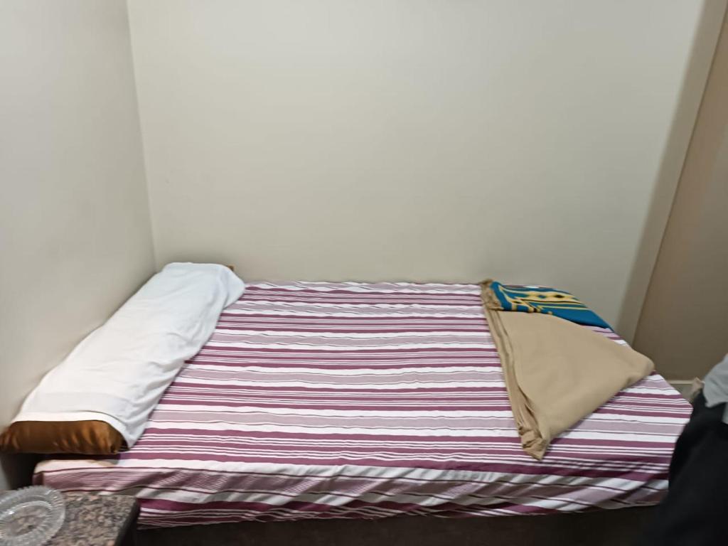 Postel nebo postele na pokoji v ubytování فندق الإيمان El Eman Hotel
