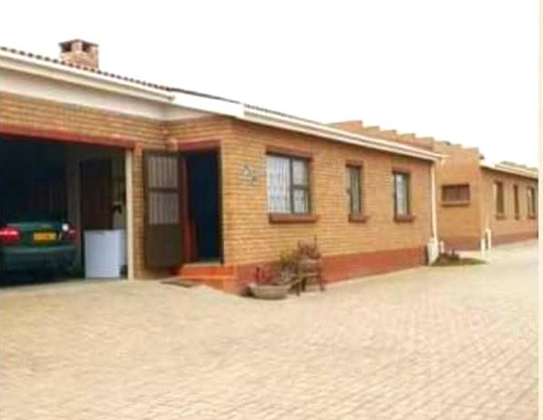 a brick house with a car parked in front of it at Sea-Esta in Hentiesbaai