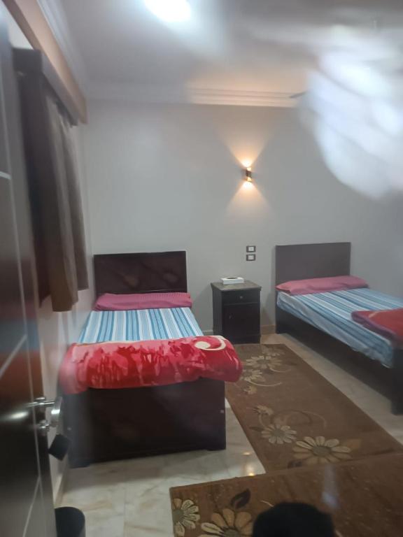 Postel nebo postele na pokoji v ubytování فندق الإيمان El Eman Hotel
