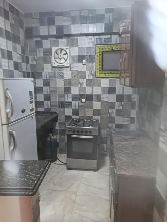 Kuchyň nebo kuchyňský kout v ubytování فندق الإيمان El Eman Hotel