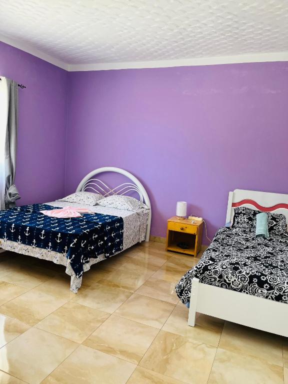 Postel nebo postele na pokoji v ubytování Casa Adriano & Filomena Montrond