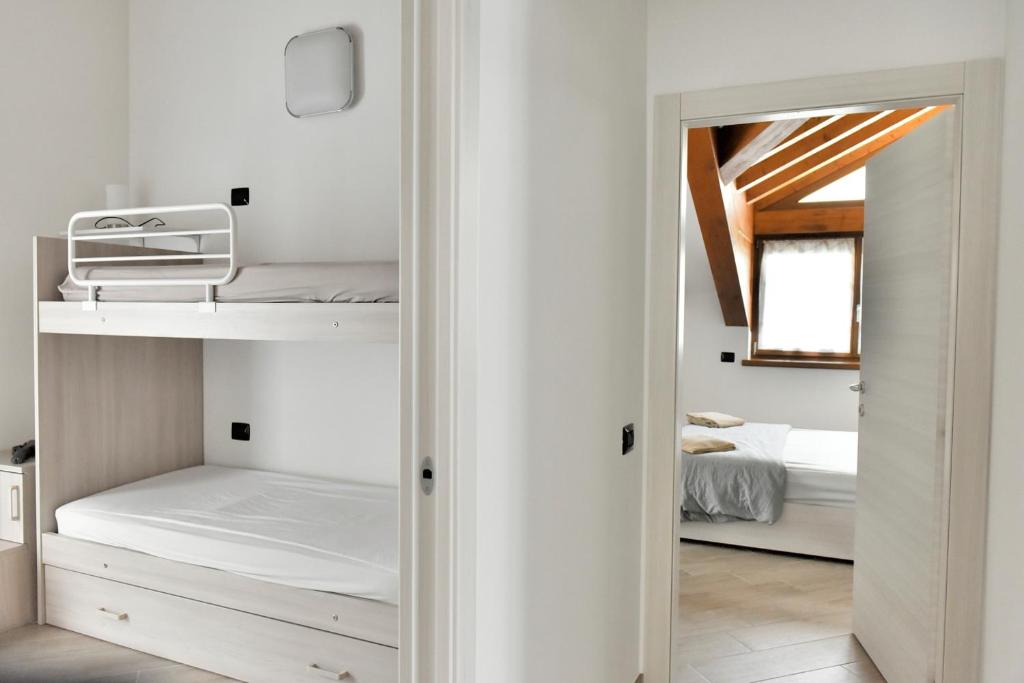 Łóżko lub łóżka w pokoju w obiekcie La Pieve Apartments