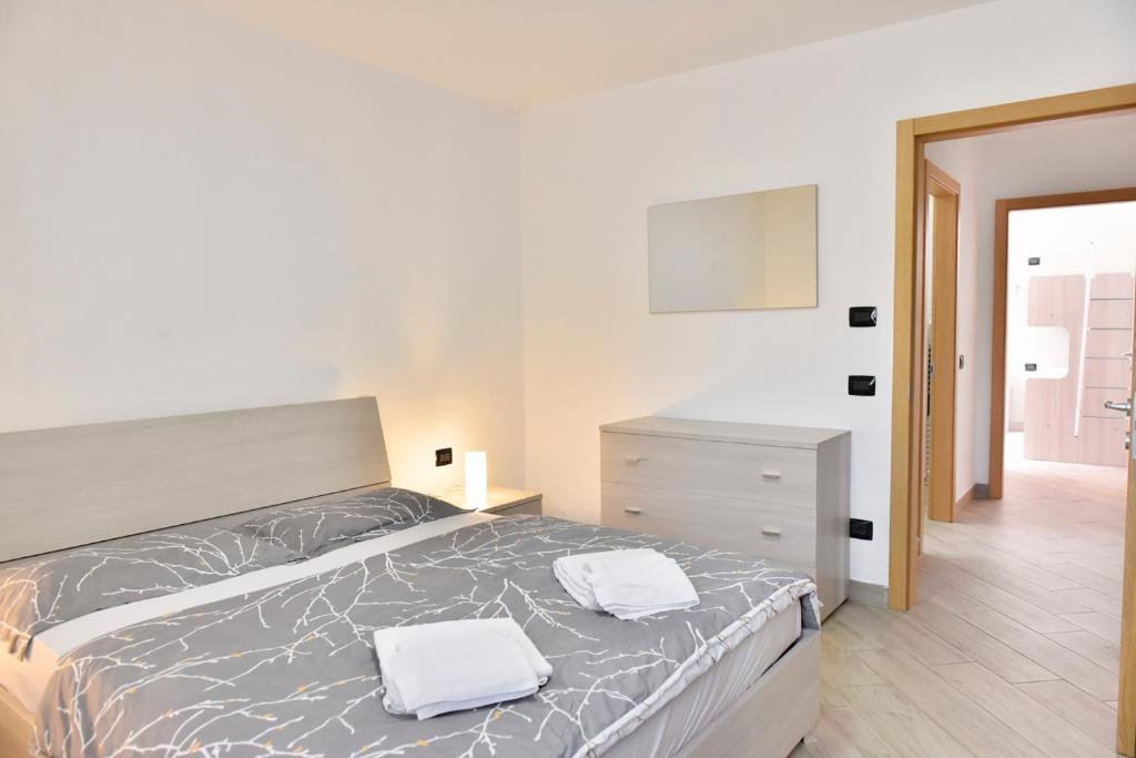 Łóżko lub łóżka w pokoju w obiekcie La Pieve Apartments