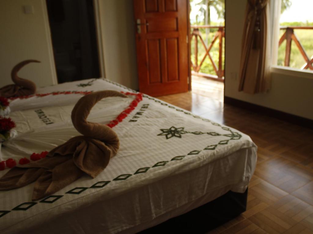 Postel nebo postele na pokoji v ubytování Shamar Guesthouse & Dive