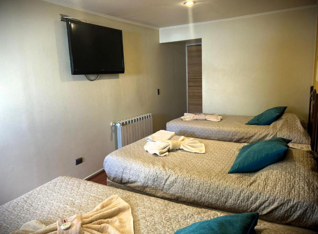 Postel nebo postele na pokoji v ubytování Hostal Don Guillermo