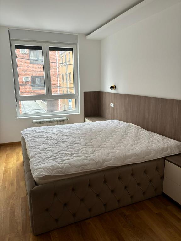 Postel nebo postele na pokoji v ubytování Apartman Akademska Četvrt
