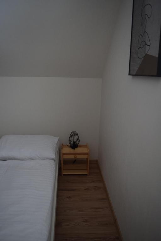 A bed or beds in a room at Penzión na Hranici Čirč