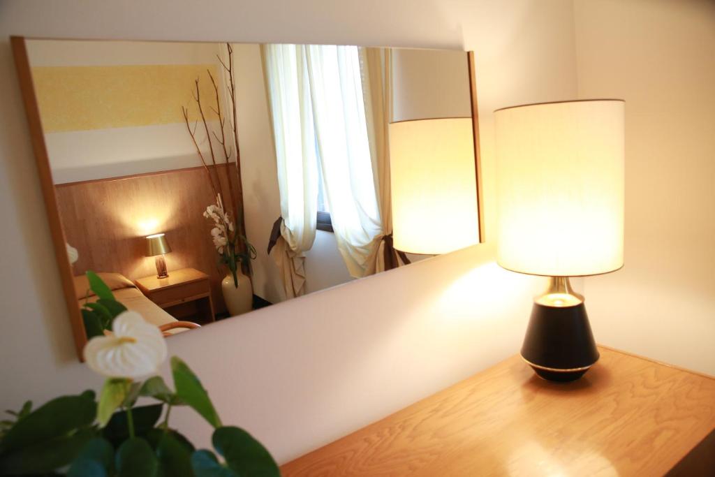 Postel nebo postele na pokoji v ubytování Hotel Al Posta