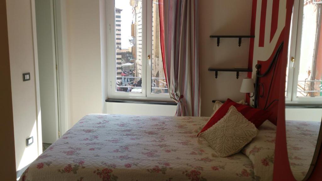 Postel nebo postele na pokoji v ubytování L'Antica Terrazza
