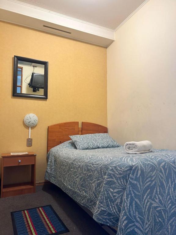 Postel nebo postele na pokoji v ubytování Hostal Don Guillermo