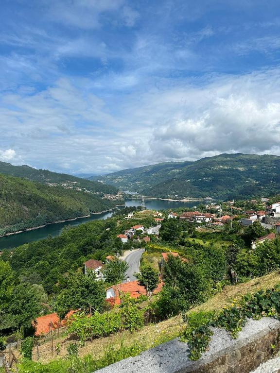 a view of a town with a river and a city at Casa Pereira in Geres