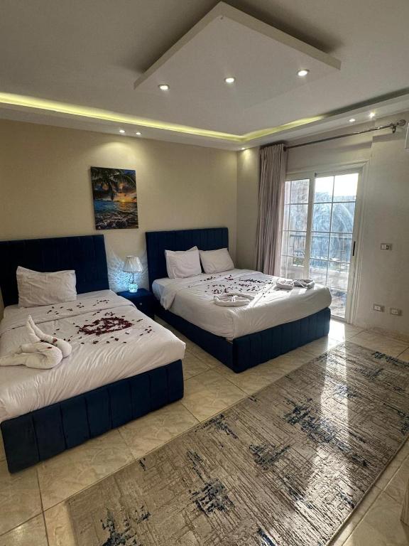 Postel nebo postele na pokoji v ubytování Pyramids Haven Hotel