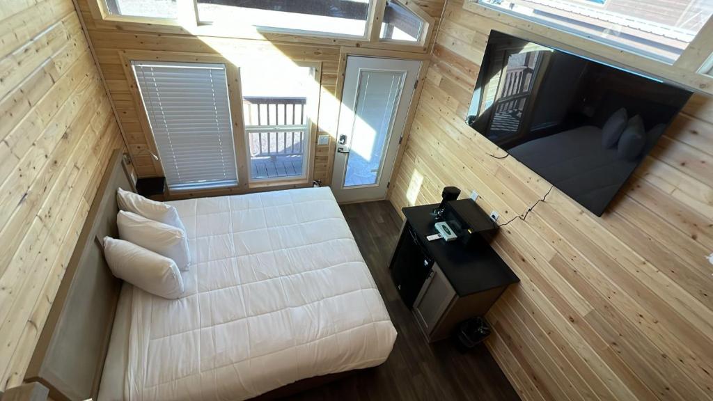 an overhead view of a bedroom in a tiny house at 060A Brand New Cozy Cabin with Loft & King bed near Grand Canyon South Rim in Valle
