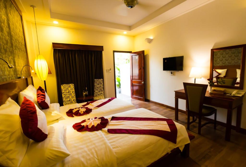 Postel nebo postele na pokoji v ubytování Phu Quoc Villa