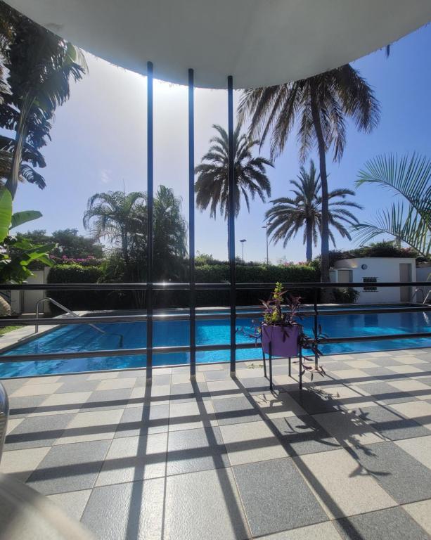 a view from the balcony of a house with a swimming pool at Maison d'hôtes villa Anna Dakar in Dakar