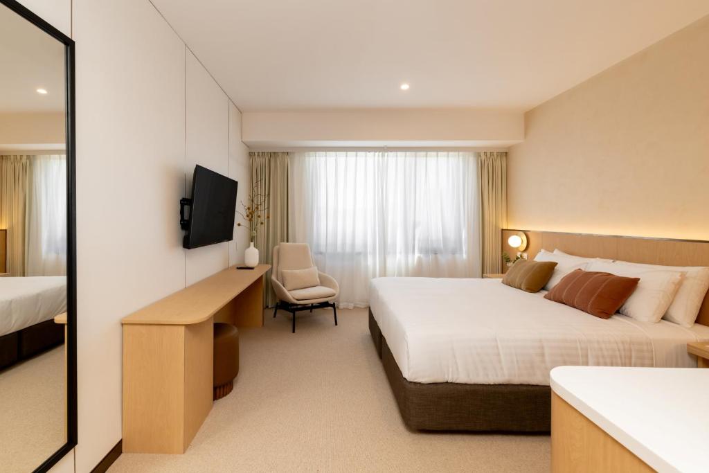Postel nebo postele na pokoji v ubytování Maxim Hotel - Auckland