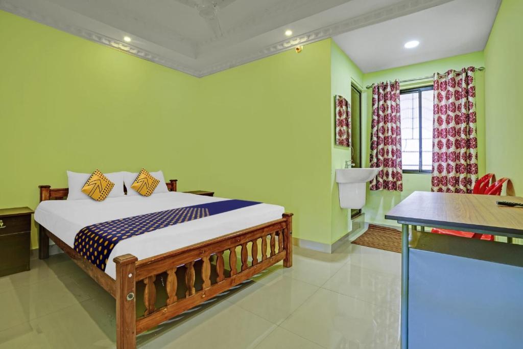 Postel nebo postele na pokoji v ubytování Hotel O SS Residency