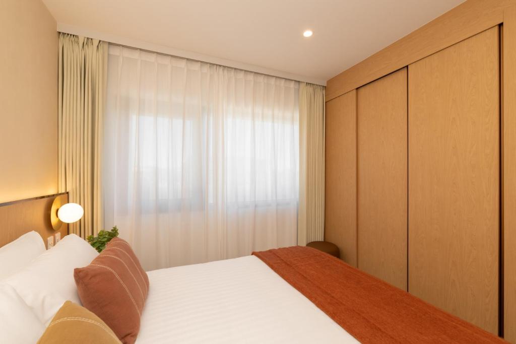 Postel nebo postele na pokoji v ubytování Maxim Hotel - Auckland