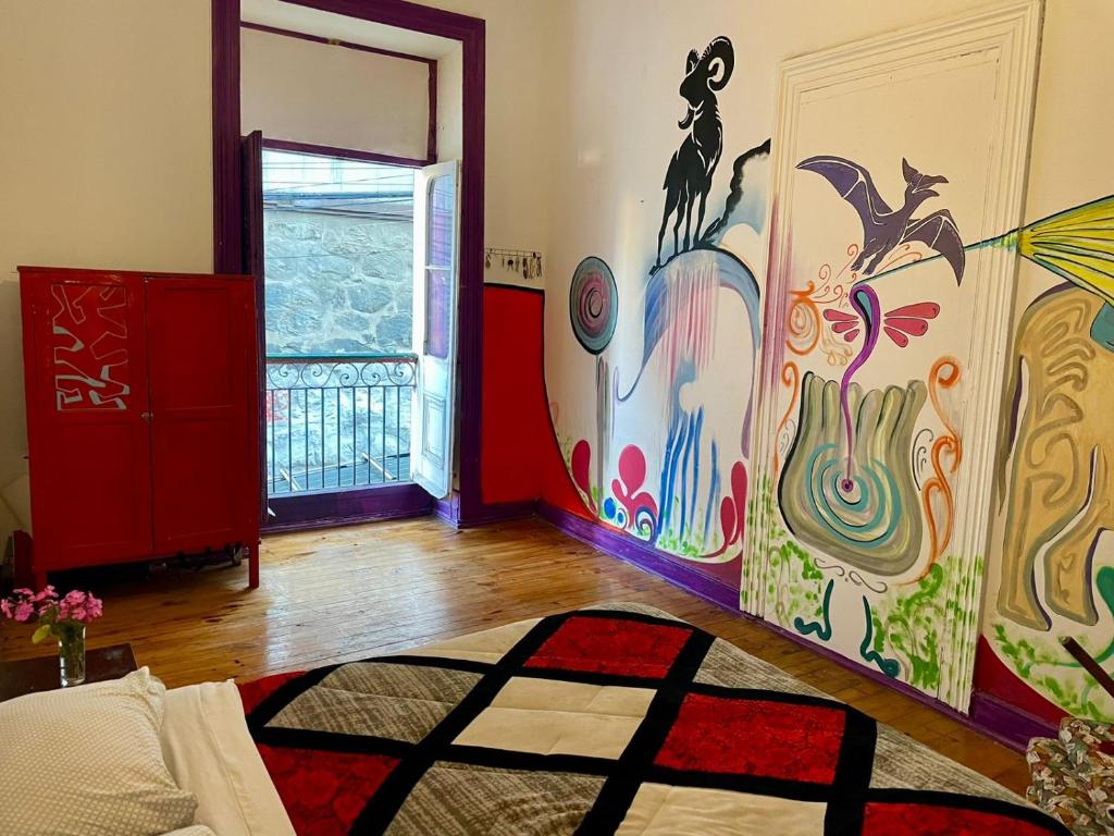 Uma cama ou camas num quarto em Art Hostel Casa Chaman
