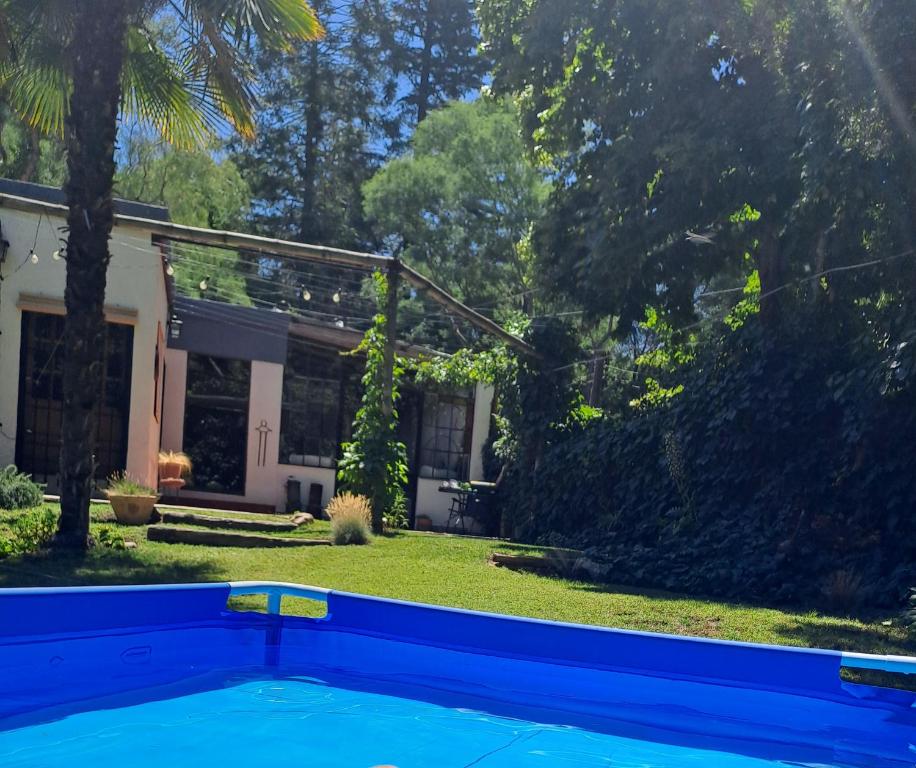a swimming pool in the yard of a house at CASA ADAGIO in Ciudad Lujan de Cuyo