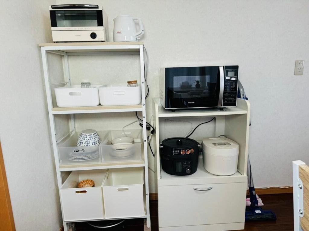 Kuchyň nebo kuchyňský kout v ubytování Nest Kisarazu