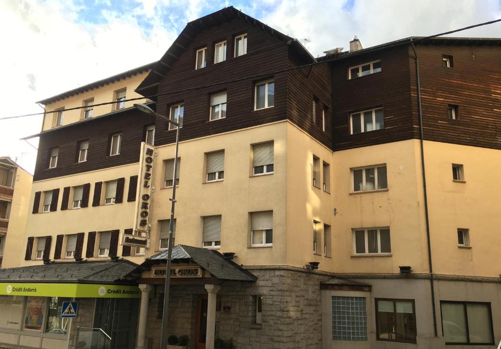 a building with a brown roof on top of it at Evenia Oros in Encamp