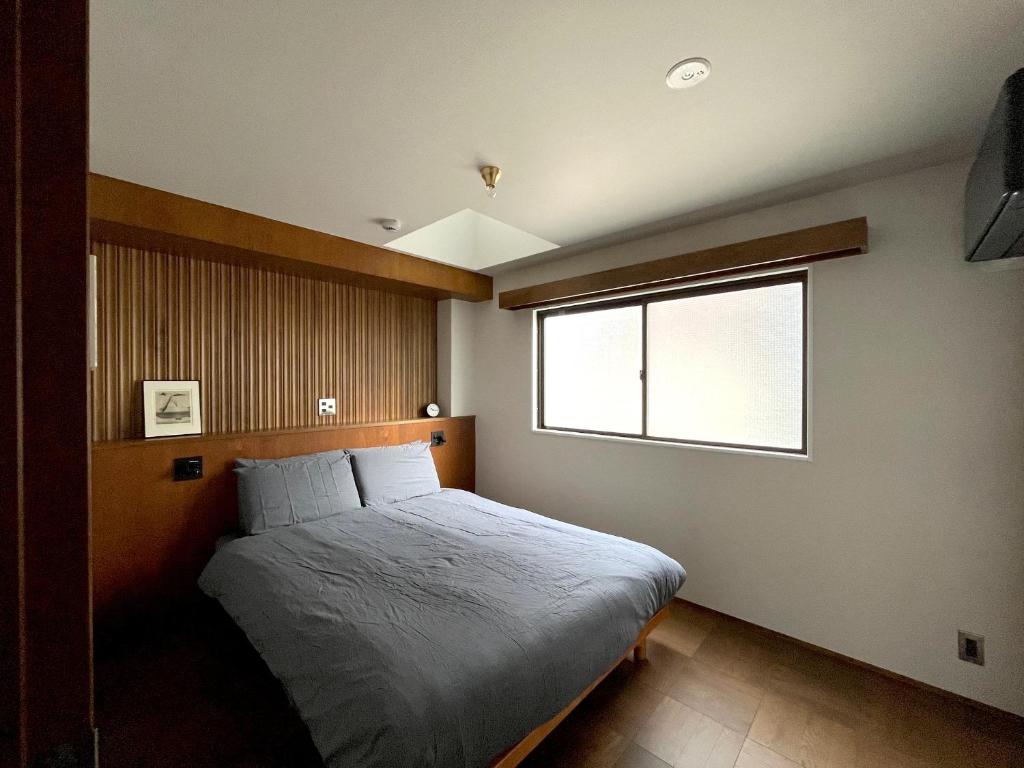 Postel nebo postele na pokoji v ubytování NO SERVICE HOTEL asakusa