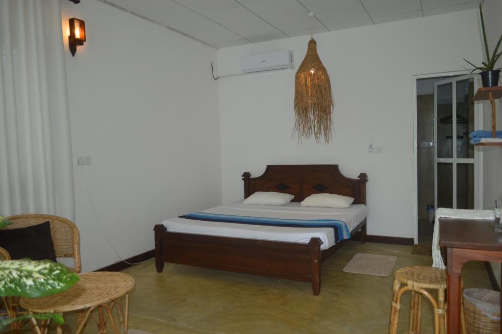 Postel nebo postele na pokoji v ubytování Coconut Grove - Midigama