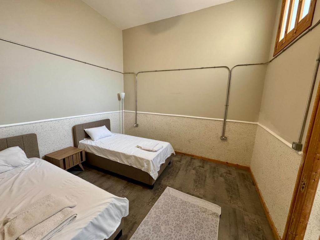 a hospital room with two beds and a window at Sunflower 2bedroom Flat North Nicosia-Turkish Side in Nicosia
