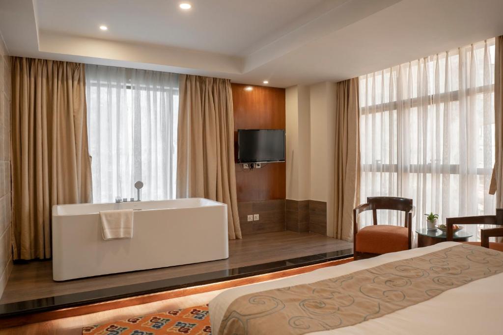 Postel nebo postele na pokoji v ubytování Hotel Shambala