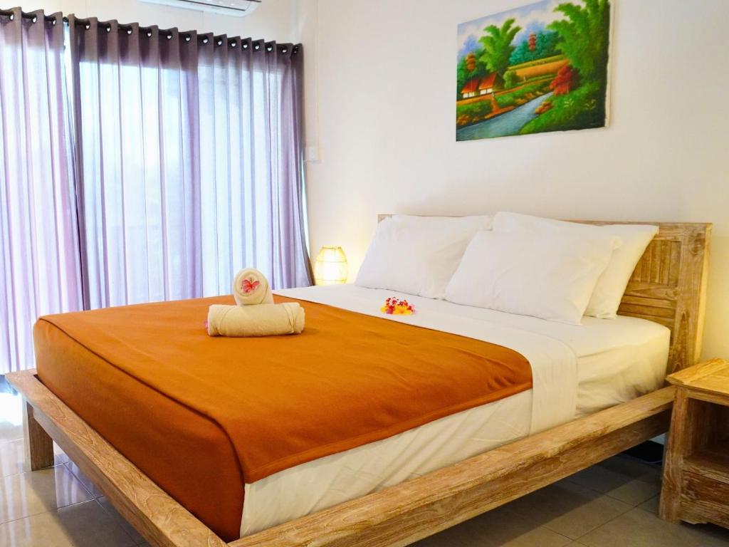 Postel nebo postele na pokoji v ubytování Summer of Surf Hostel Uluwatu