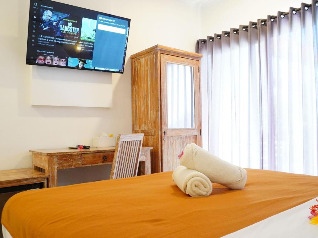 Postel nebo postele na pokoji v ubytování Summer of Surf Hostel Uluwatu