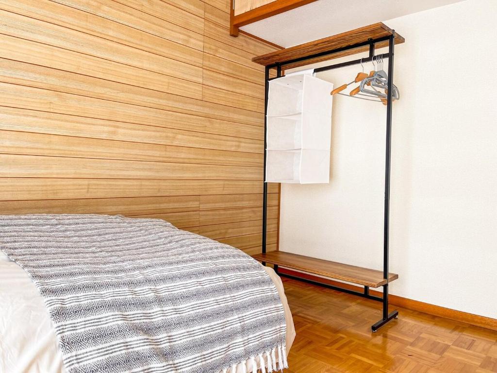 Postel nebo postele na pokoji v ubytování Sakuradai House