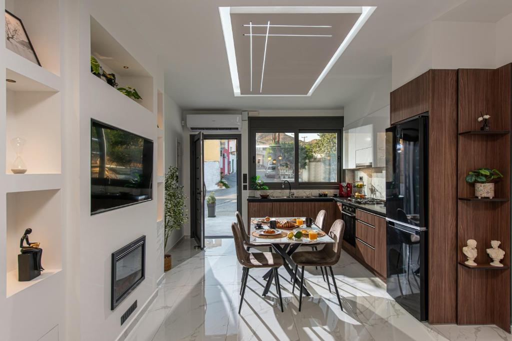 a kitchen with a table with food on it at Savvy Apartments in Áyioi Dhéka