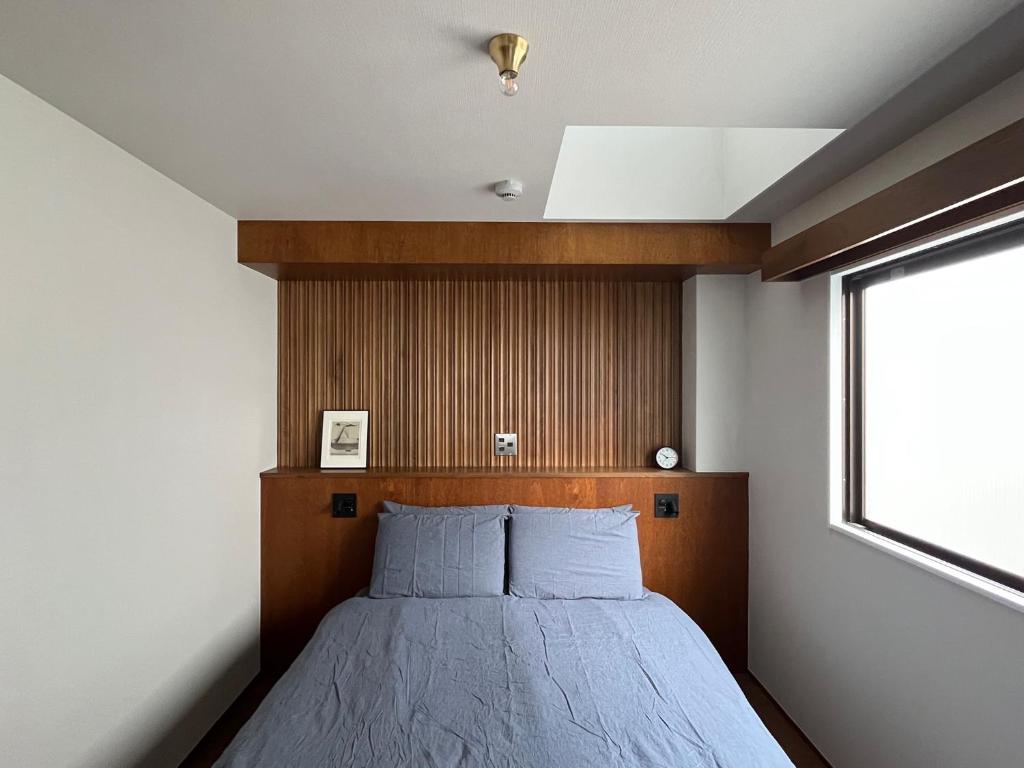 Postel nebo postele na pokoji v ubytování NO SERVICE HOTEL asakusa