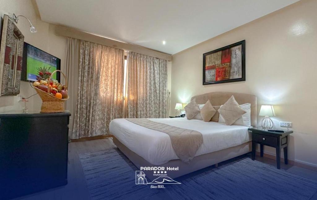 Postel nebo postele na pokoji v ubytování Hotel Parador