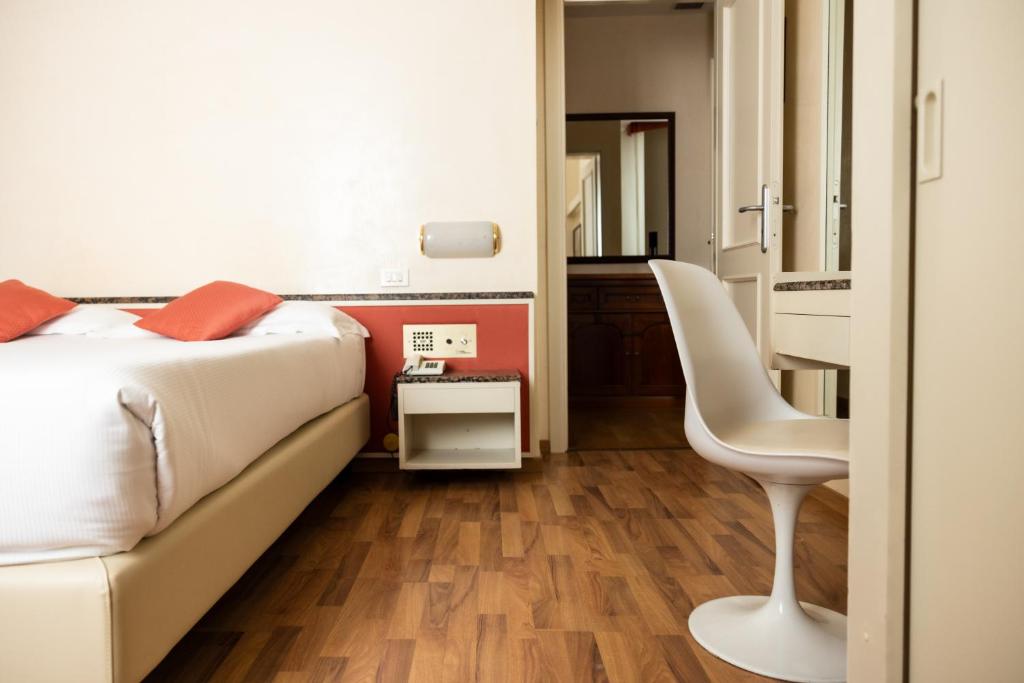 Postel nebo postele na pokoji v ubytování Hotel Rosabianca