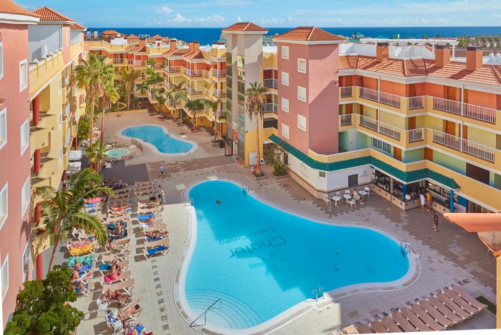 an aerial view of the resort and the pool at Hotel Chatur Costa Caleta in Caleta De Fuste
