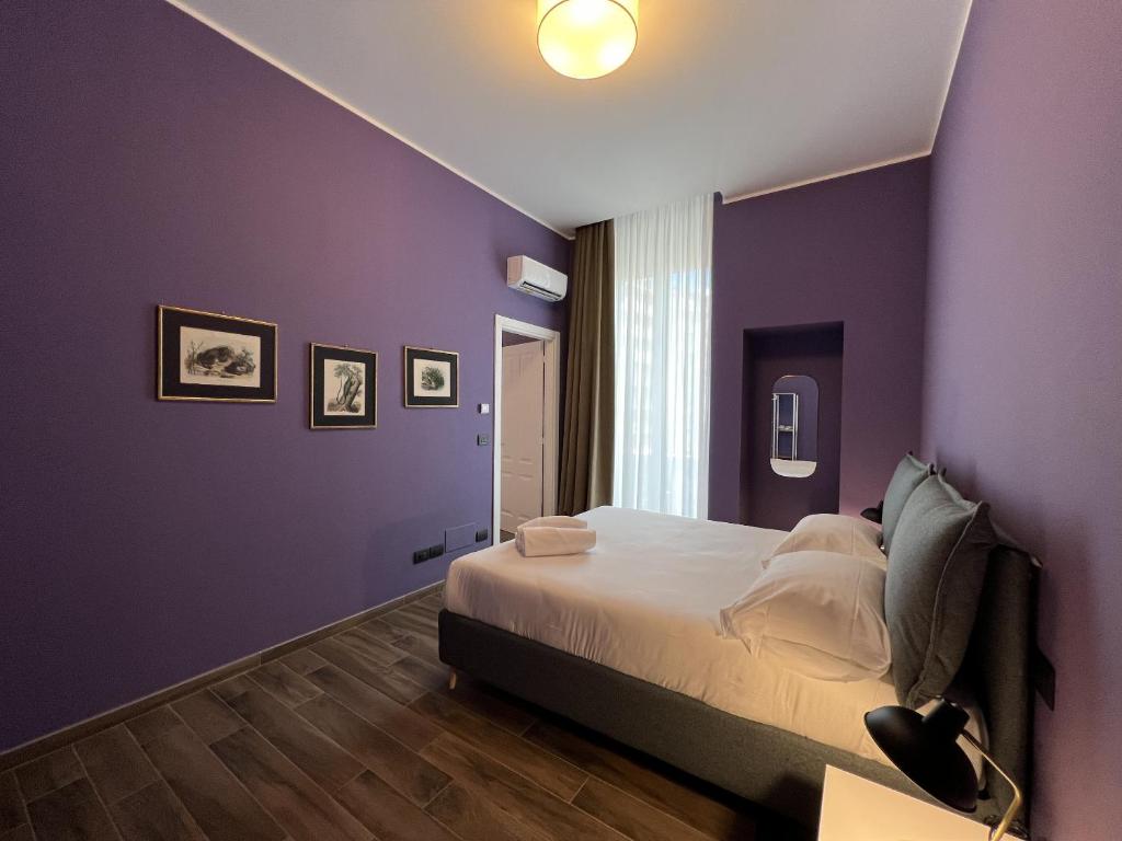 מיטה או מיטות בחדר ב-Palazzo Zippitelli Apartments