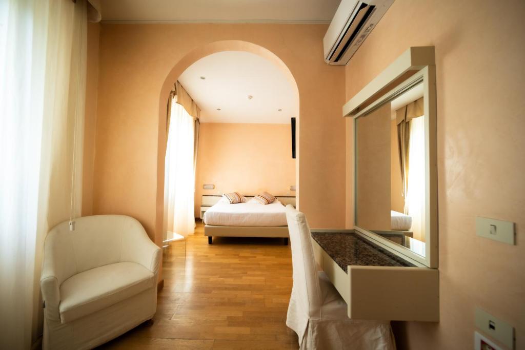 Postel nebo postele na pokoji v ubytování Hotel Rosabianca