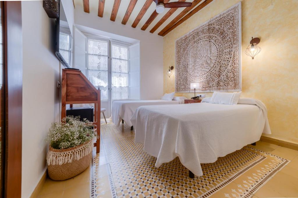 Postel nebo postele na pokoji v ubytování Hotel Argantonio